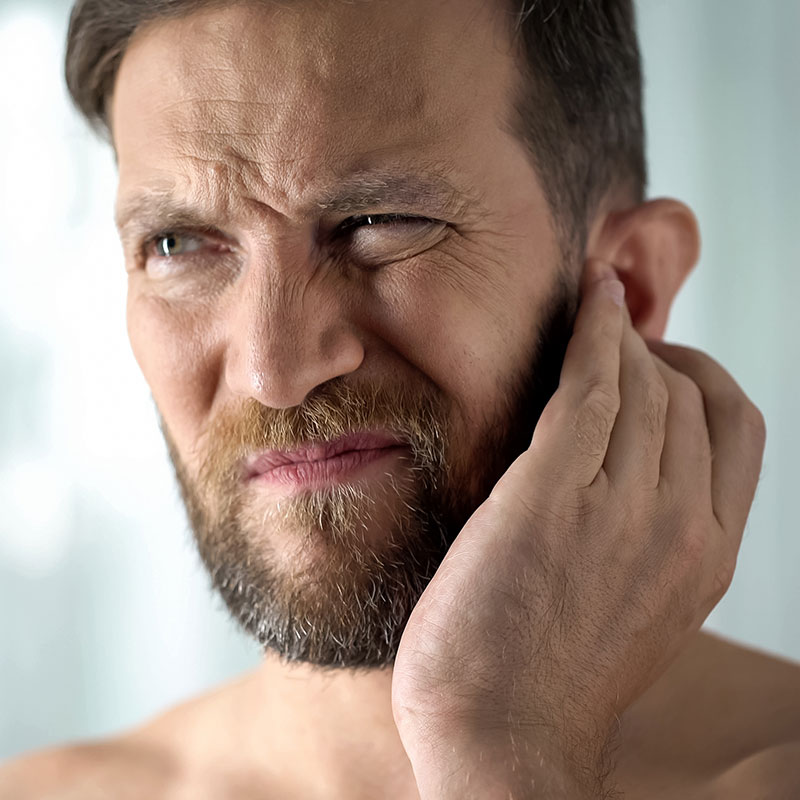 Man with a confused look because he has Auditory Processing Disorder.