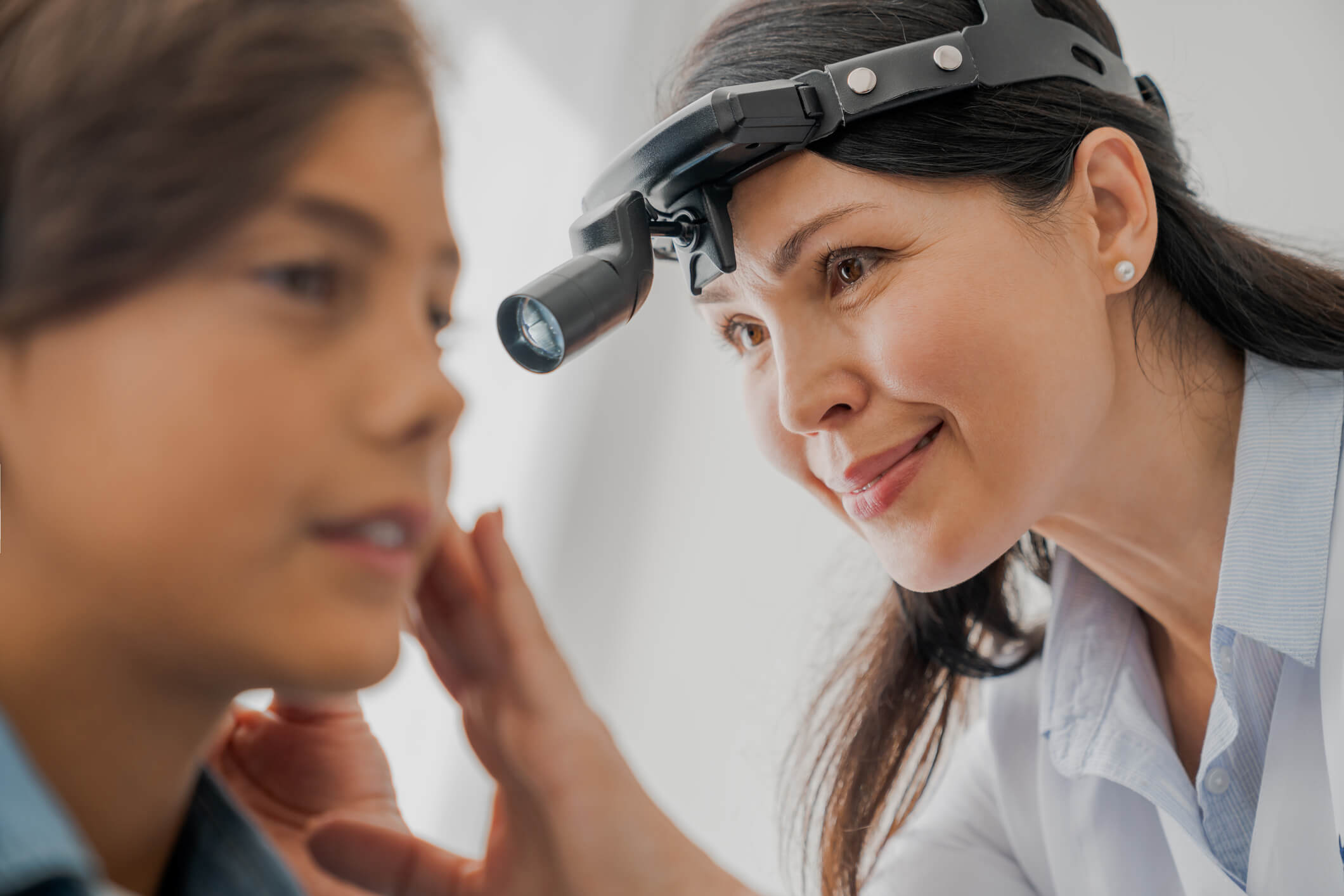 Doctor examining a patient's ear